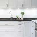 Handgreep 1353 - Gepolijst Messing/Zwart Leer